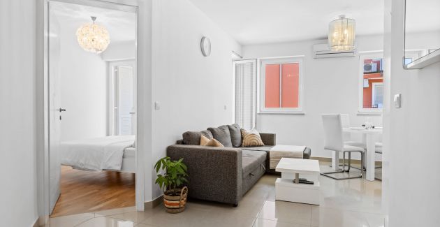 Charming White Apartment with Balcony and Parking