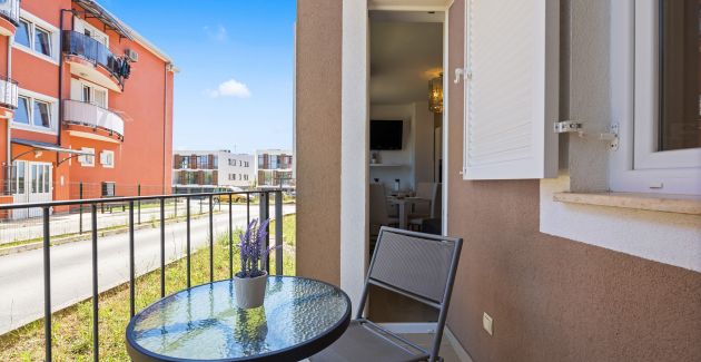 Charming White Apartment with Balcony and Parking