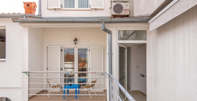 Apartment Dezela with two balconies