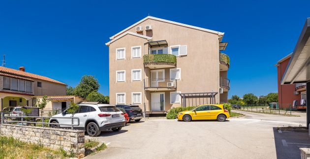 Charming White Apartment with Balcony and Parking